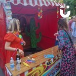 Cactus Stoss Stall Hire at a corporate Summer event with the client staffing the stall and her colleague having a game