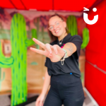 Event Team member holding up a peace sign in the Cactus Toss Side Stall