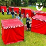 A group shot of 6 stalls set up together at a corporate event
