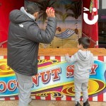 Coconut Shy Stall Hire being used by a father and son at a community high street event
