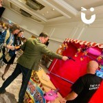 Cork Shoot Hire Image at a corporate party with a man trying his best to win a prize whilst colleagues watch on
