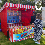 Woman throwing hoops at our Hoopla Side Stall