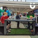 Subsoccer Table at an indoor promotional event for a shopping center with 2 young brothers going head to head