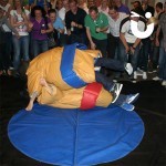 One man pinning another under the Sumo Adult Hire