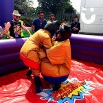 Two adults competing on the Sumo Adult Hire