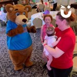 Fun Bear Hire  at a family party smiling at a baby