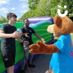 Fun Bear Hire at a corporate fun day happy to see 2 Fun Experts