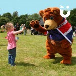 Sunshine Bear Hire giving a high five