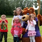 Sunshine Bear Hire holding the Olympic Torch