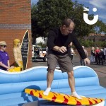 man on the surf simulator during a community day