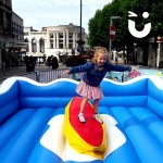 surf simulator with a young girl