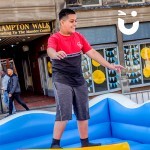 young man on the surf simulator