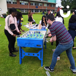 Universities students playing on the table football