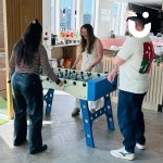 Table football being enjoyed at an office fun day