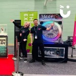 The Vault set up and ready at an exhibition with 2 happy Fun Experts