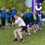 For the final of a business team building event, one team tries with all their might to be the winning team