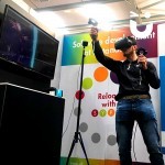A guest interacts with the Virtual Reality on hire from Sunshine Events and in use as part of a promotional launch at an exhibition.