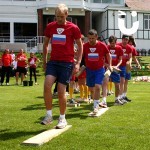 As part of an olympics style, corporate team building event, a team representing France take on the Walk the Plank challenge