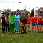Teams take on the Walk The Plank challenge in fancy dress as part of a corporate Team Building event outdoors
