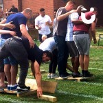 Two teams go head to head in a semi final challenge of Walk The Plank as part of their company team building day