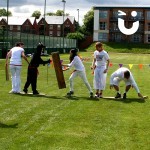 A team take on the challenge of Walk The Plank as part of their outdoor team building event on a glorious summers day