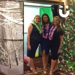 Christmas Themed Photo Booth at a Winter Wonderland Event with ladies smiling for a photo