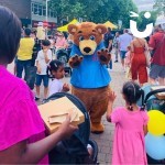 Fun Bear making friends at a community event