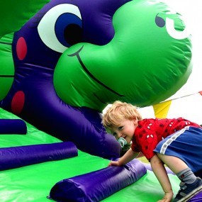 Children's Dino Inflatable Slide Hire