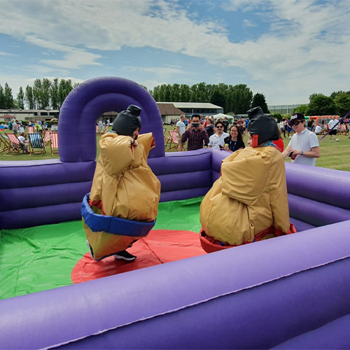 two students competing in our sumo suits