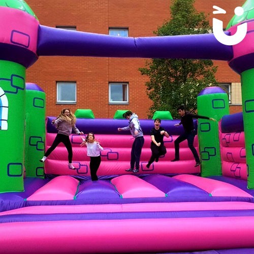 Children playing on the bouncy castle hire