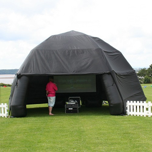 A guest under the Inflatable Canopy Hire  during an outdoor event