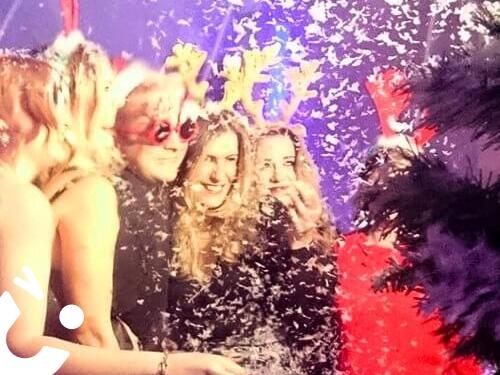Snow Globe in our Winter Wonderland Entertainment Package - ladie wearing reindeer antlers